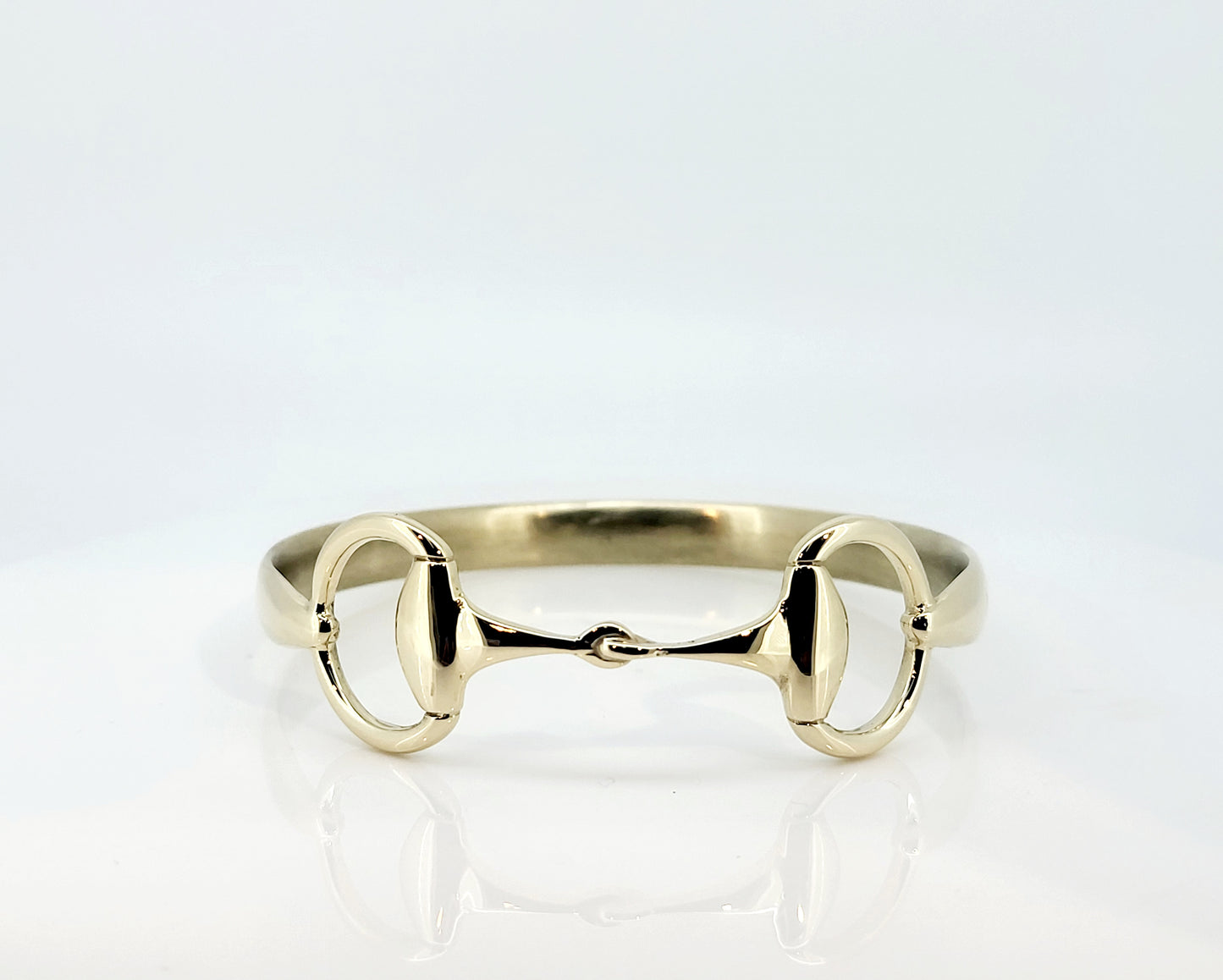 Solid 9ct yellow gold snaffle bangle.
