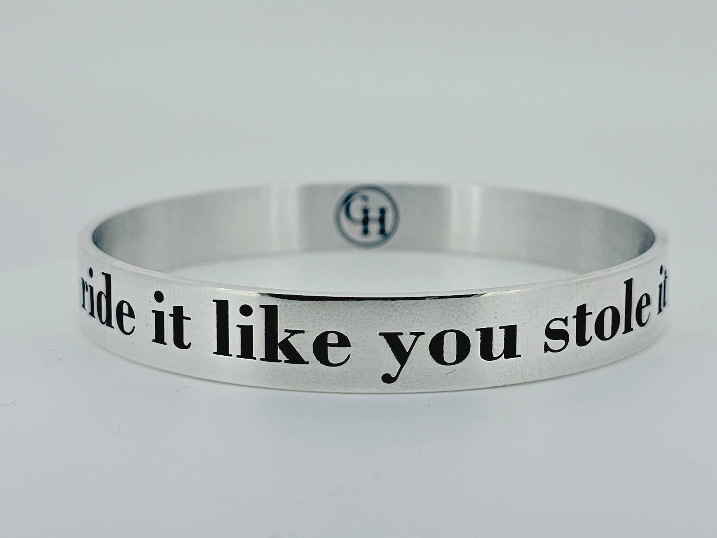 Ride it like you stole it, in sterling silver with black enamel.