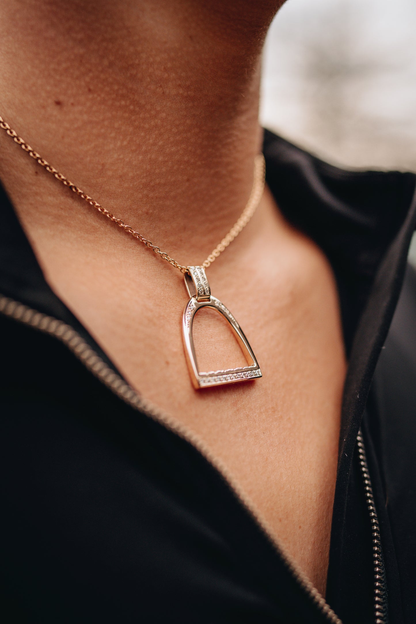 Large diamond set stirrup pendant on a 9ct yellow gold cable chain