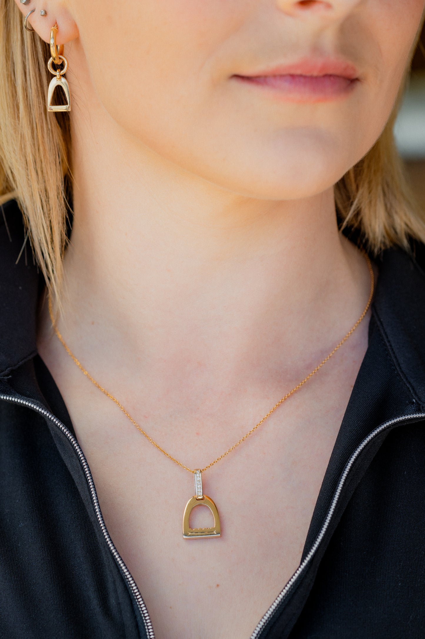 9ct yellow gold small stirrup pendant with a diamond set bale on a 9ct yellow gold chain
