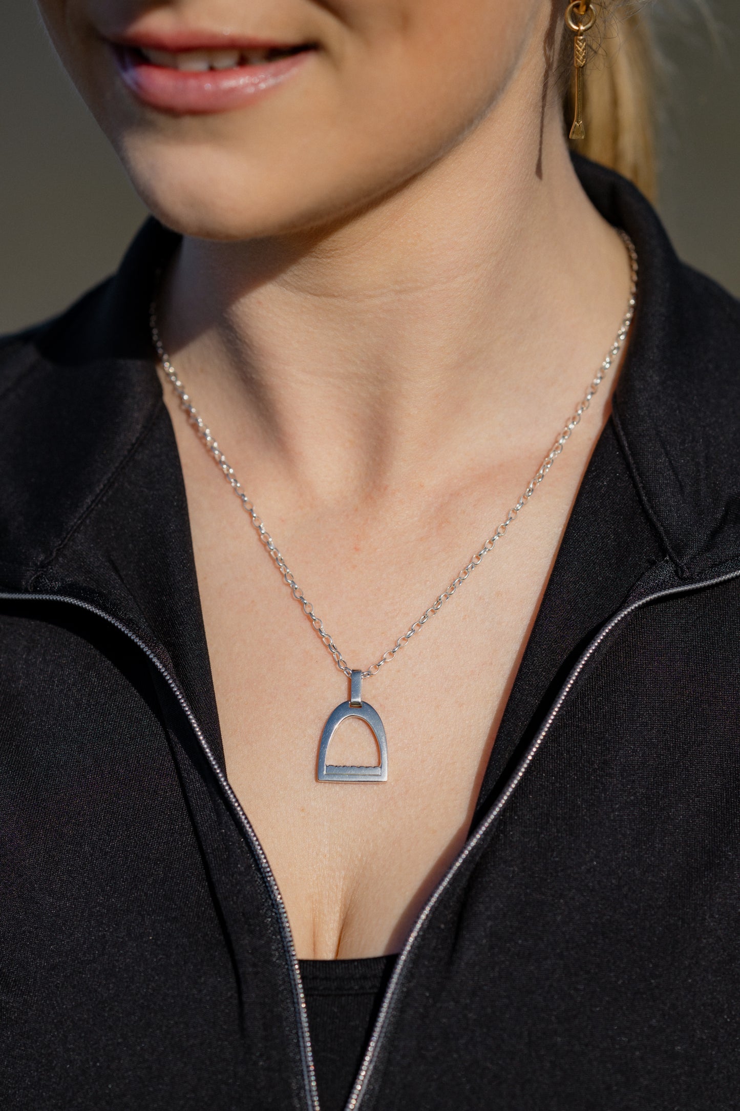 Sterling silver medium stirrup pendant on a fine sterling silver oval belcher chain