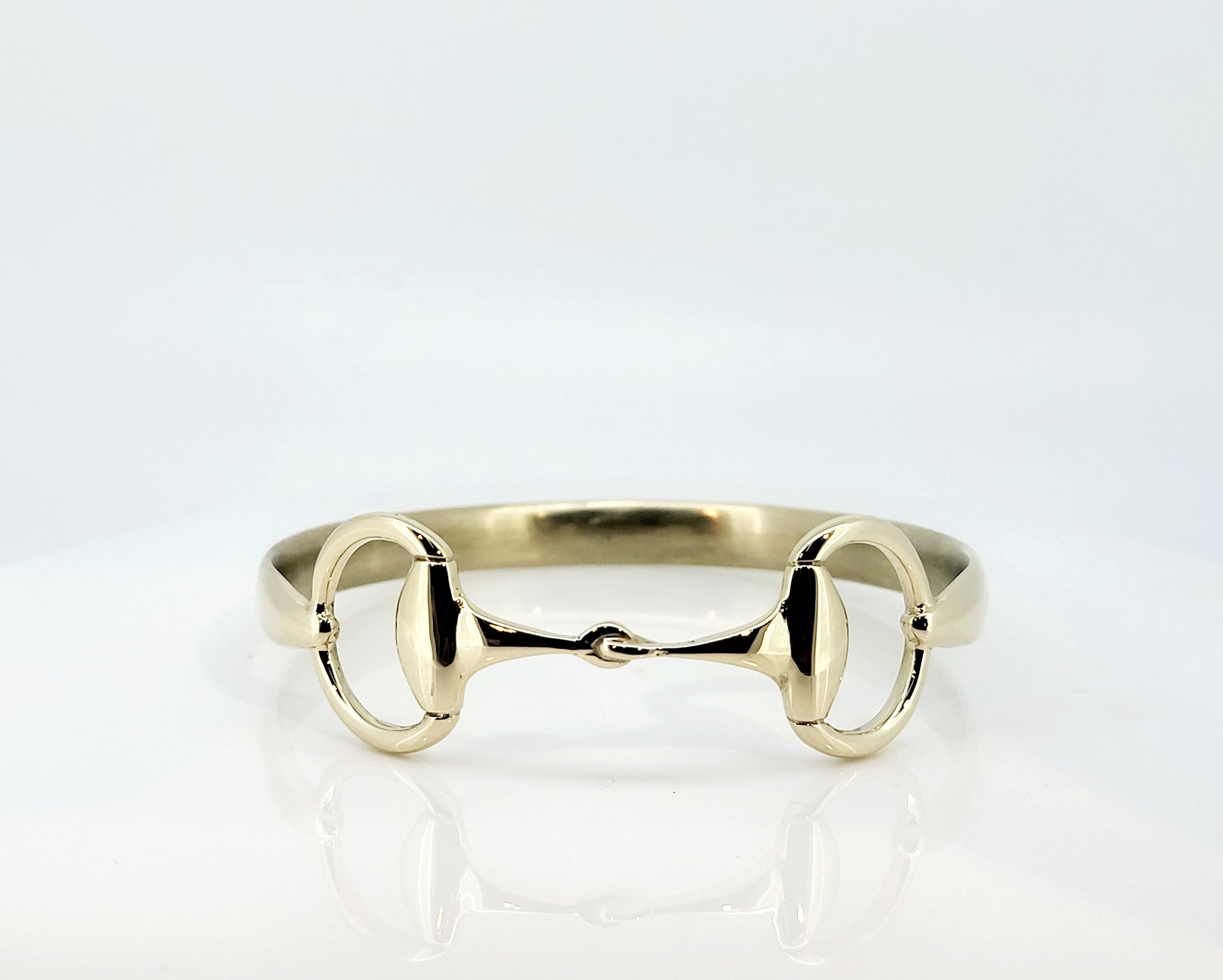 Solid 9ct yellow gold snaffle bangle. 
