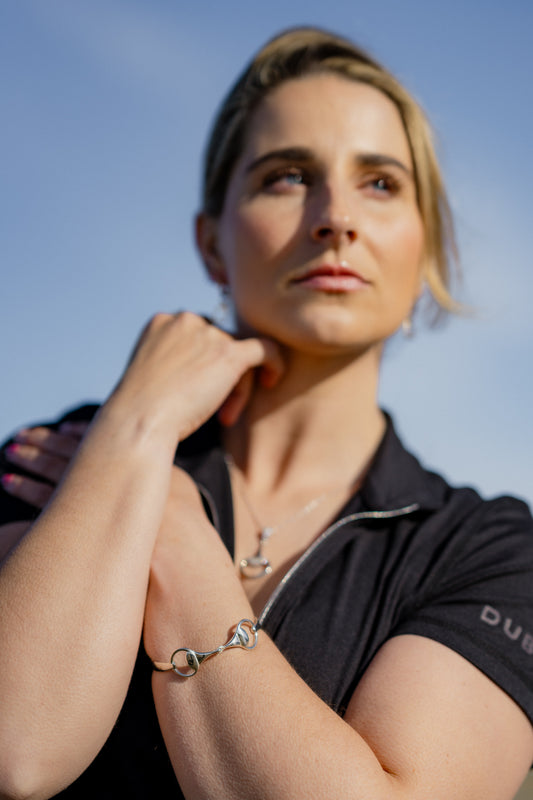 An equestrian wearing the most popular Crawford Hill bangle. The Snaffle Bangle. Beautifully crafted, solid and tough. The perfect bangle for an equestrian. 