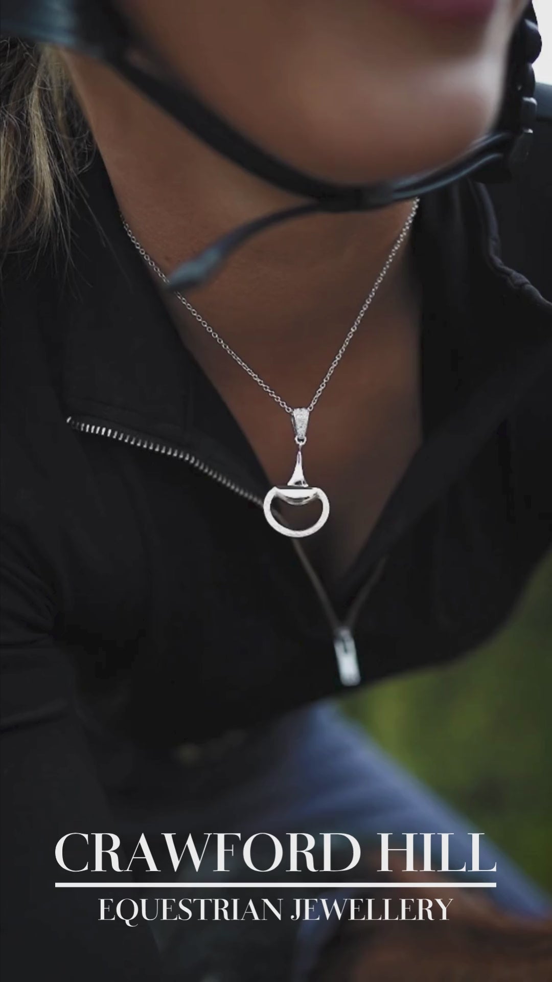 Video of an equestrian horse rider earing a white gold, diamond set half snaffle pendant by Crawford Hill Equestrian Jewellery. 